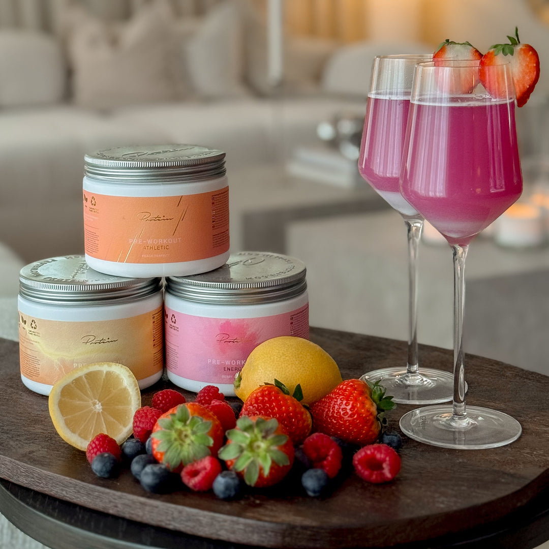 Candle set with fruits and drinks on a table in a living room setting